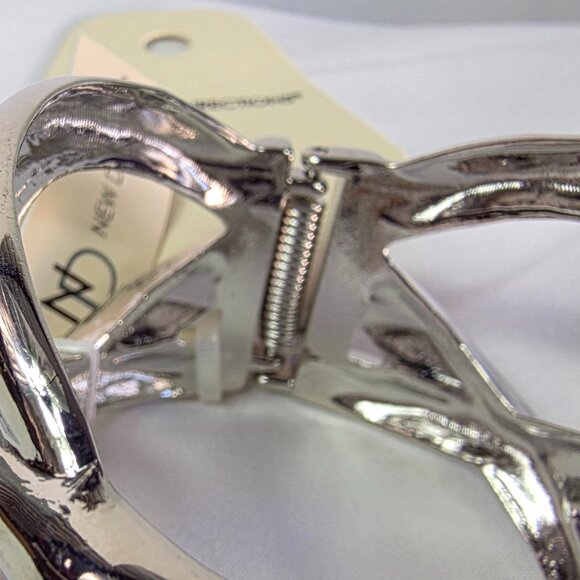 New Directions Silver Tone Knot Bangle Bracelet Featuring an Abstract Design - Picture 2 of 10